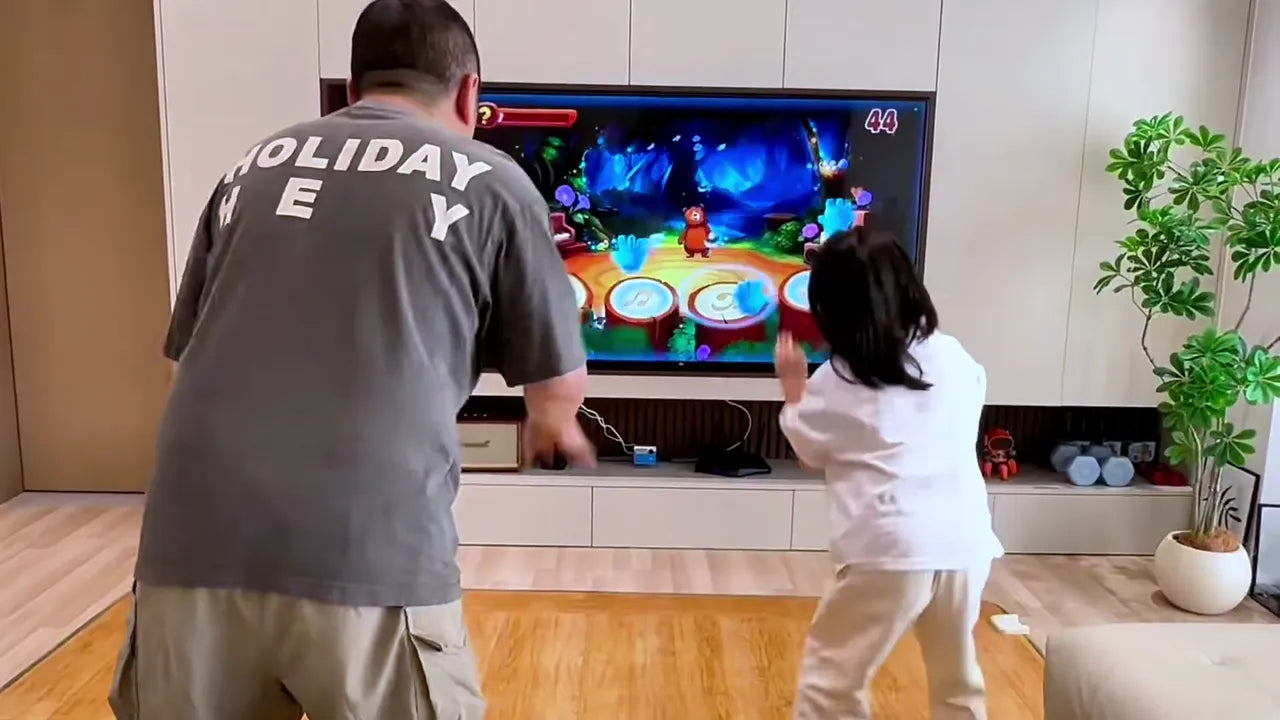 A parent and child playing KINHANK MotionX together at home